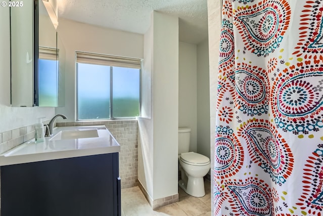 173 NE 32nd Ave, Hillsboro, OR 97124 - bathroom with a textured ceiling, toilet, vanity, and tile patterned floors