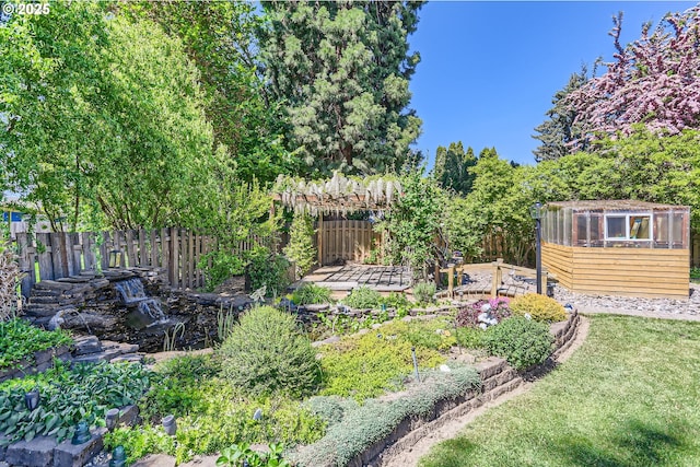 173 NE 32nd Ave, Hillsboro, OR 97124 - view of yard with an outdoor structure, an exterior structure, and a vegetable garden