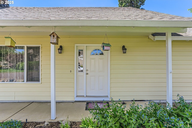 173 NE 32nd Ave, Hillsboro, OR 97124 - property entrance with a shingled roof and covered porch
