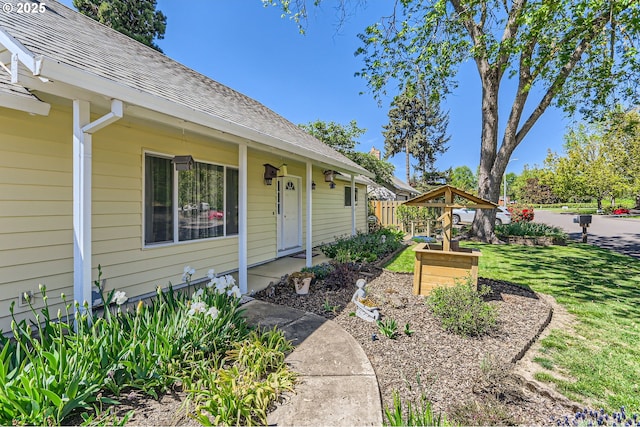 173 NE 32nd Ave, Hillsboro, OR 97124 - doorway to property with a shingled roof and a lawn