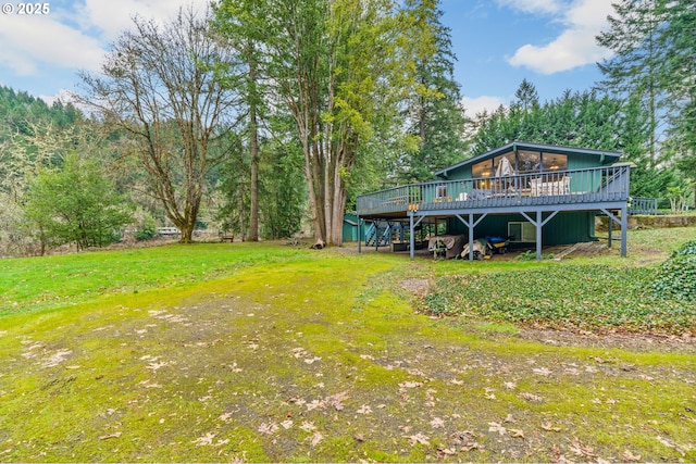 view of yard with a wooden deck