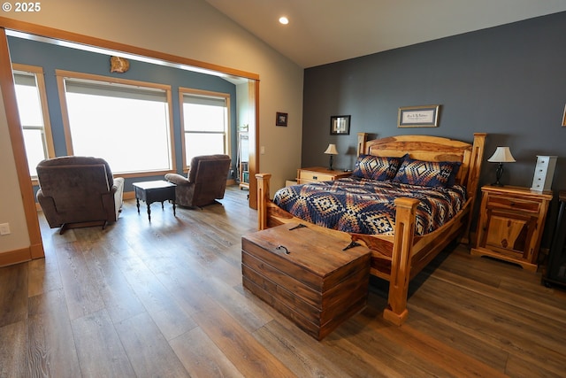 bedroom with recessed lighting, vaulted ceiling, and wood finished floors