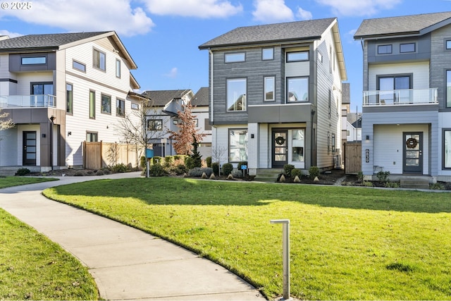 view of front of property with a front yard and a residential view