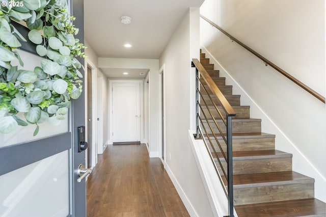 interior space featuring baseboards, wood finished floors, and recessed lighting