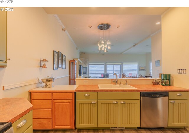 kitchen featuring a chandelier, hanging light fixtures, ornamental molding, sink, and stainless steel dishwasher