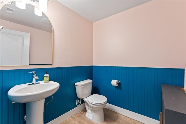 7510 NW Lauren Ave, Portland, OR 97229 - half bath featuring wood finished floors and wainscoting