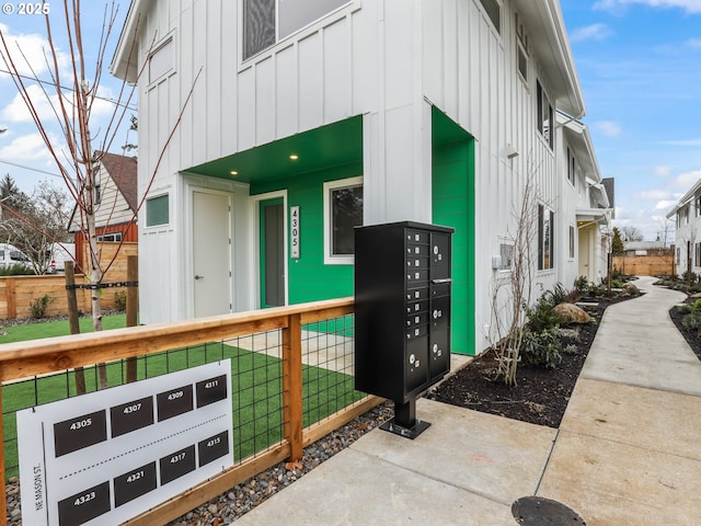 view of side of home with mail boxes