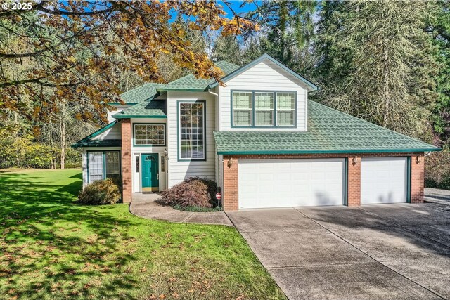 view of front property with a garage and a front lawn