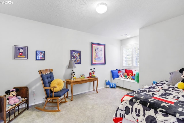 bedroom featuring carpet, a textured ceiling, and baseboards