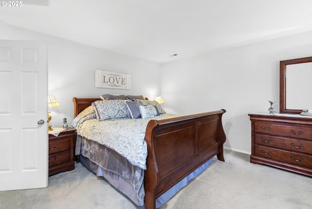 bedroom featuring baseboards and light colored carpet