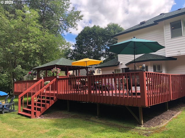 wooden deck with a yard