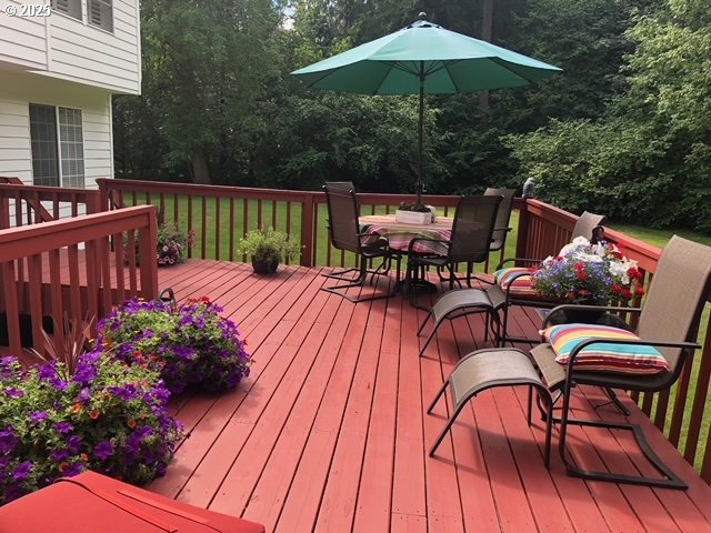 wooden deck with outdoor dining area