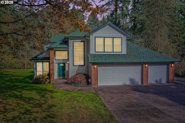 view of front facade with driveway, a shingled roof, an attached garage, a front yard, and brick siding