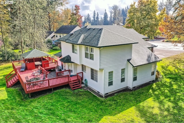 back of property featuring a deck, a shingled roof, a yard, crawl space, and a chimney