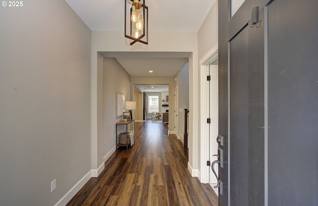 hallway with dark hardwood / wood-style floors