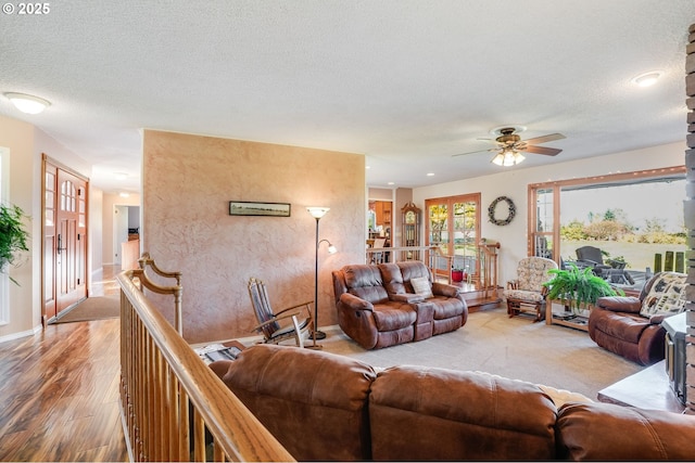 4212 NE 179th St, Vancouver, WA 98686 - living room with ceiling fan, a textured ceiling, light wood-type flooring, and baseboards