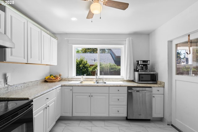 kitchen featuring stainless steel appliances, light marble finish flooring, white cabinets, and a sink