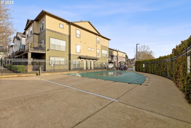 view of swimming pool featuring a patio area