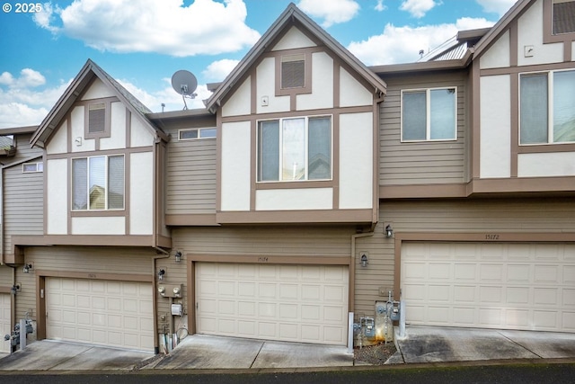 english style home with a garage