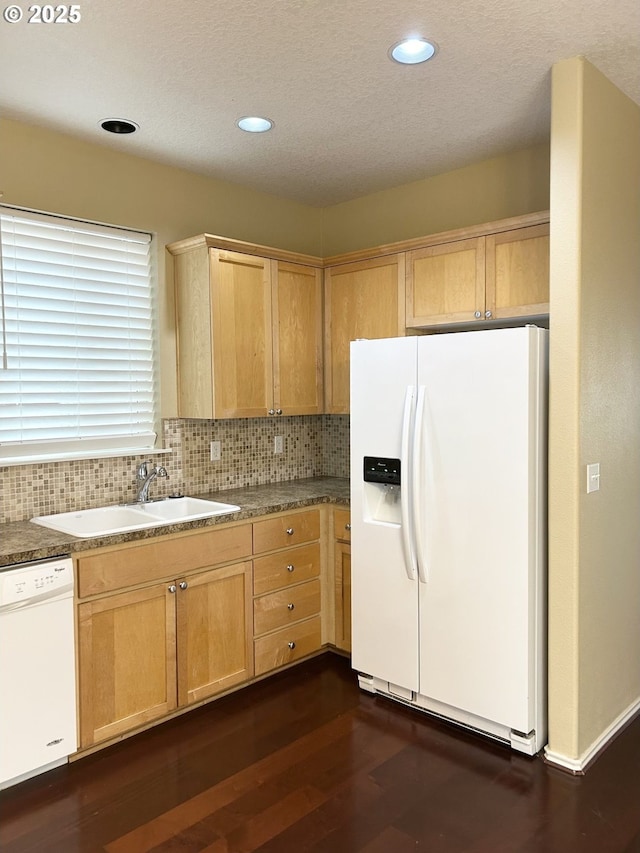 15779 SW Harvester Ln, Sherwood, OR 97140 - kitchen featuring white appliances, a sink, dark wood-style floors, light brown cabinetry, and decorative backsplash