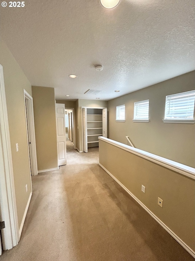 15779 SW Harvester Ln, Sherwood, OR 97140 - basement featuring light colored carpet, a textured ceiling, baseboards, and recessed lighting