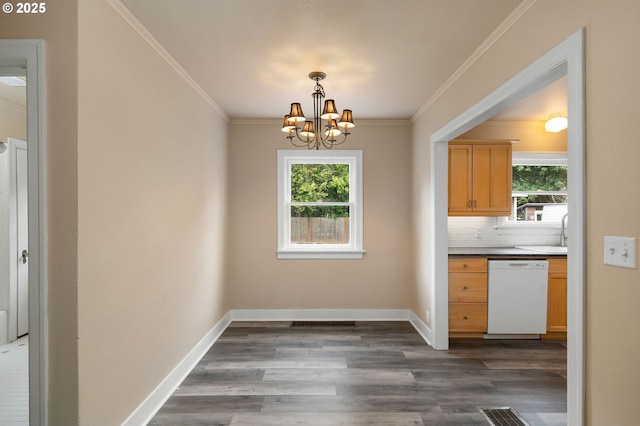 7817 SE Ellis St, Portland, OR 97206 - unfurnished dining area with plenty of natural light, dark wood-style flooring, a chandelier, and ornamental molding