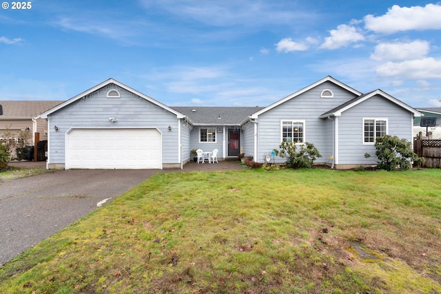 ranch-style home featuring a garage, driveway, a front yard, and fence