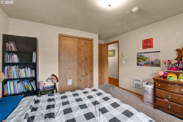 bedroom with light carpet, baseboards, and a closet