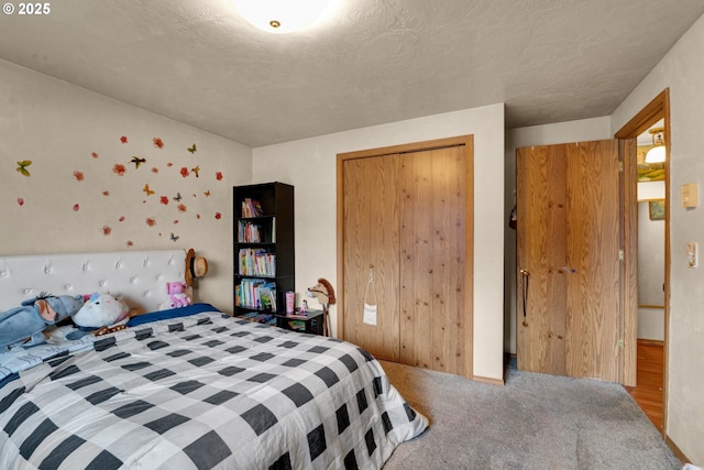 bedroom featuring a textured ceiling, a closet, and carpet