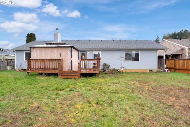 back of house featuring a yard, a chimney, crawl space, a deck, and a fenced backyard