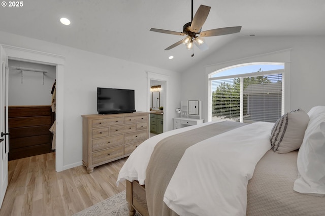 1027 Turtledove Loop, Lebanon, OR 97355 - bedroom with lofted ceiling, light wood-style floors, a walk in closet, recessed lighting, and ceiling fan