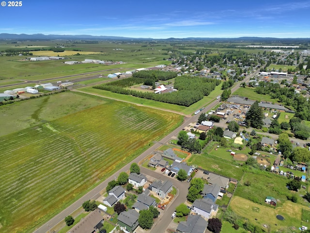 1027 Turtledove Loop, Lebanon, OR 97355 - aerial view of property's location featuring a mountainous background and nearby suburban area