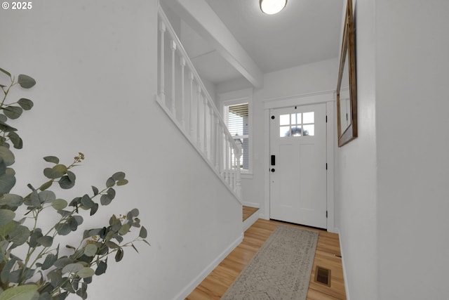 1027 Turtledove Loop, Lebanon, OR 97355 - foyer entrance featuring stairway and light wood-style flooring