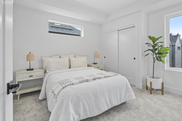 carpeted bedroom featuring a closet