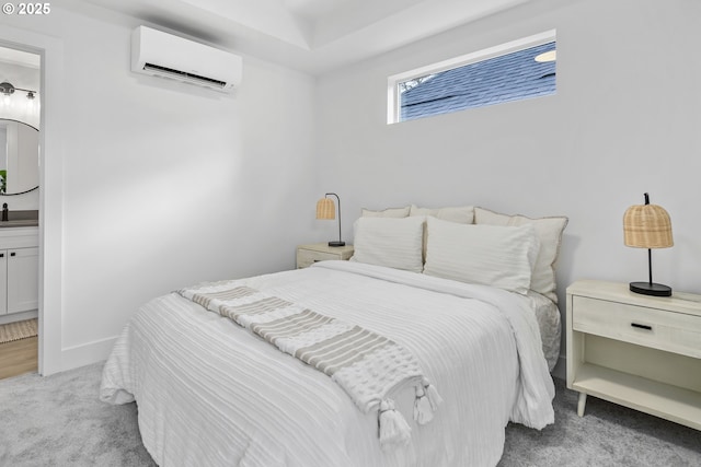 carpeted bedroom featuring an AC wall unit
