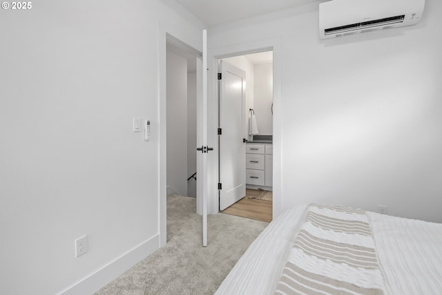 carpeted bedroom with a wall mounted AC