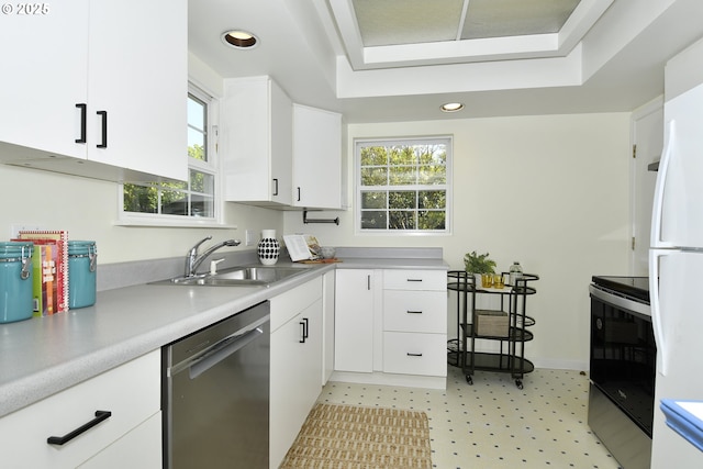 3334 NE 16th Ave, Portland, OR 97212 - kitchen with appliances with stainless steel finishes, a sink, white cabinets, light countertops, and recessed lighting