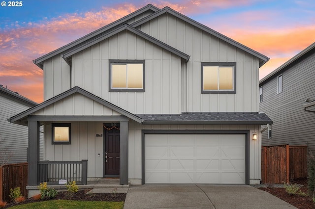 view of front facade with a garage and covered porch