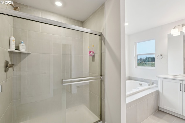 bathroom with vanity, tile patterned flooring, and independent shower and bath