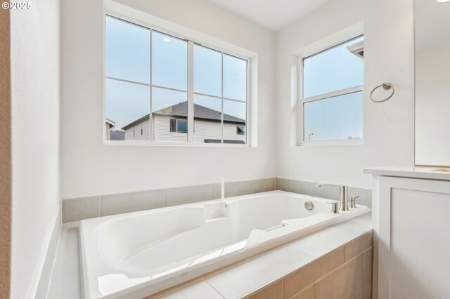 bathroom with tiled bath