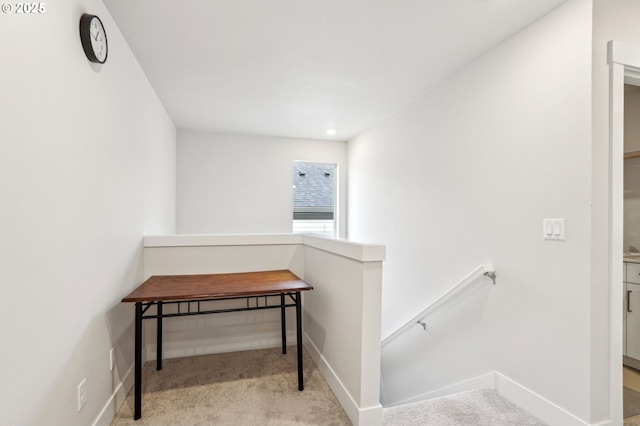 hallway with light carpet