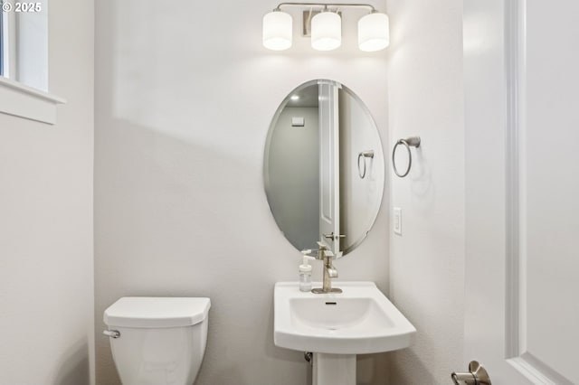 bathroom featuring sink and toilet