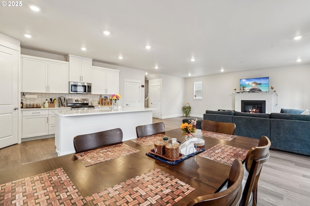 dining room with light hardwood / wood-style floors