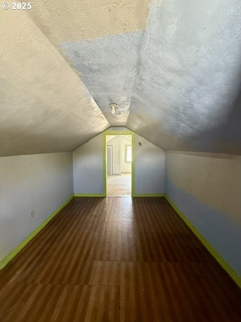 318 SW Brent Dr, John Day, OR 97845 - additional living space featuring a textured ceiling, lofted ceiling, and wood finished floors