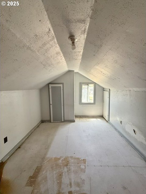 318 SW Brent Dr, John Day, OR 97845 - additional living space with vaulted ceiling and a textured ceiling