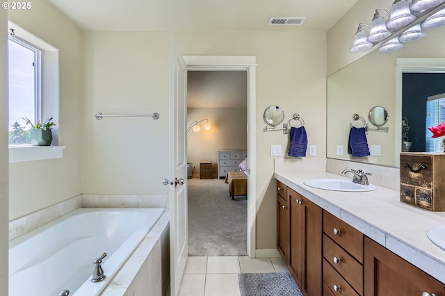 9288 SW Diamond View Way, Beaverton, OR 97007 - full bath featuring ensuite bathroom, vanity, a garden tub, and tile patterned flooring