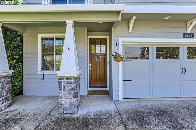 9288 SW Diamond View Way, Beaverton, OR 97007 - doorway to property with a porch and a garage