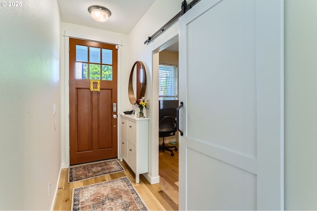 9288 SW Diamond View Way, Beaverton, OR 97007 - foyer featuring light wood-type flooring and a barn door