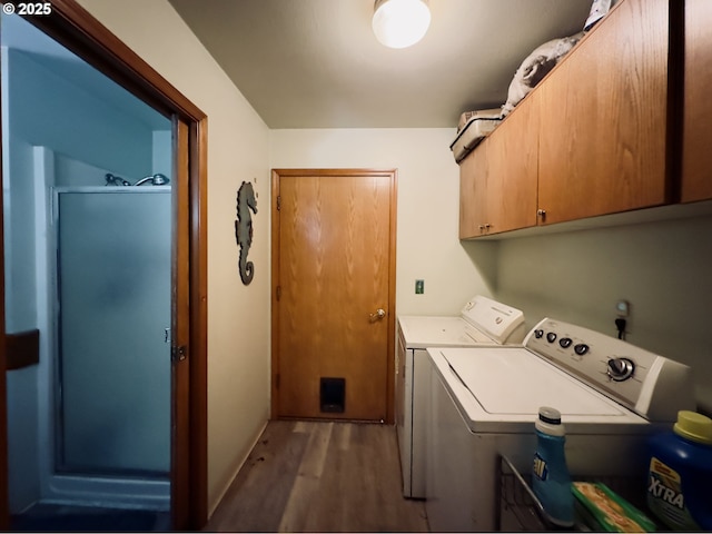 818 NW 359th St, La Center, WA 98629 - laundry room with cabinet space, wood finished floors, and washer and clothes dryer