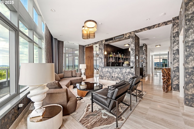 3601 S River Pkwy Unit 3101, Portland, OR 97239 - living area featuring healthy amount of natural light and bar area